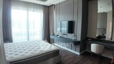 Modern bedroom with large window and stylish decor