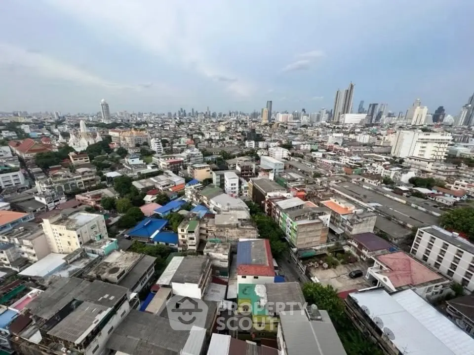 Stunning cityscape view showcasing urban skyline and diverse architecture from a high vantage point.
