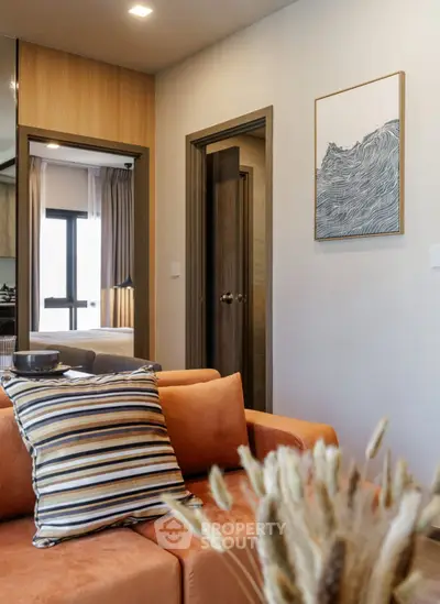 Modern living room with stylish decor and cozy ambiance in a contemporary apartment.