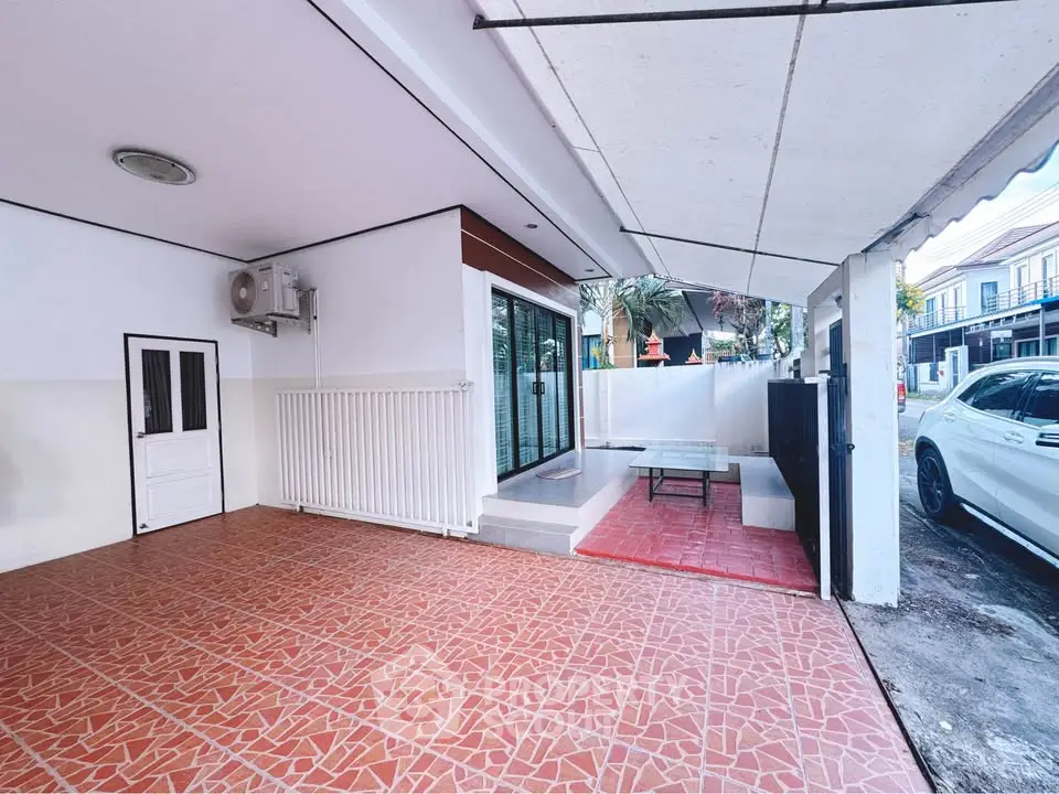 Spacious covered patio with tiled flooring and modern design