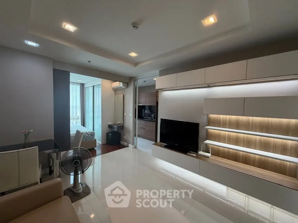 Modern living room with sleek built-in shelving and ambient lighting