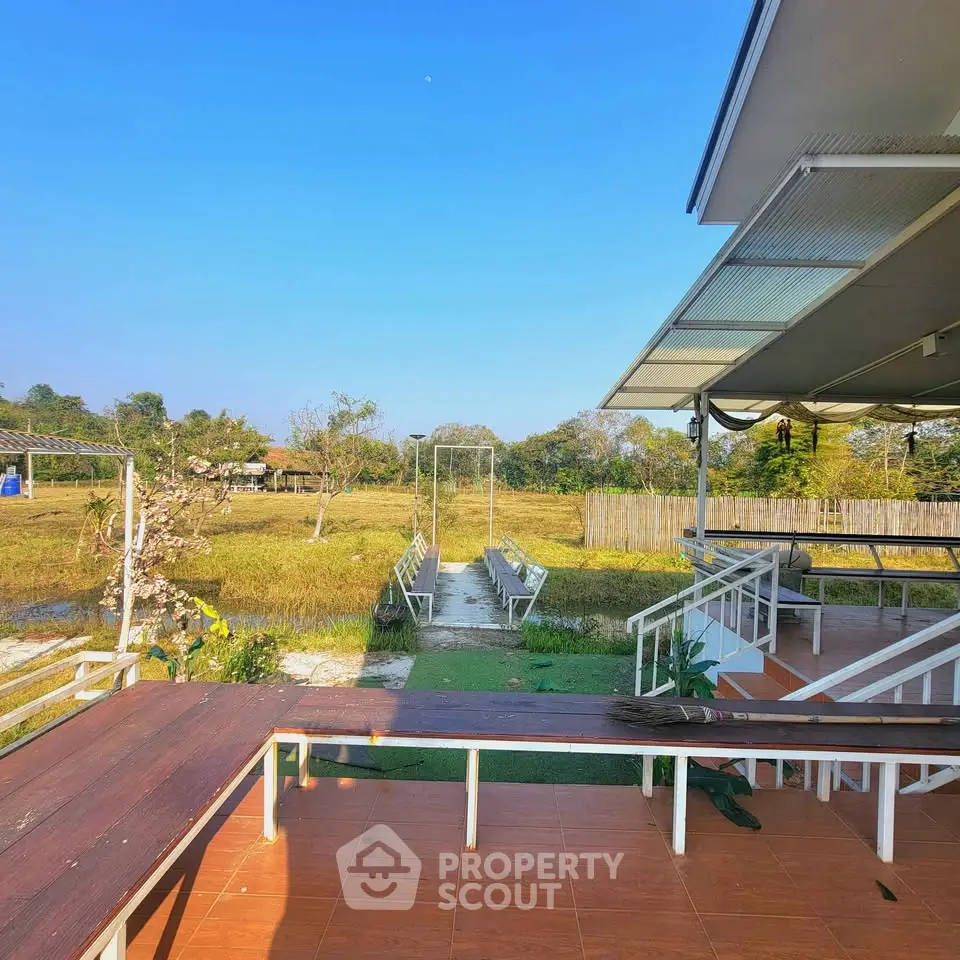 Charming outdoor space with scenic view and modern patio seating, perfect for relaxation and gatherings.