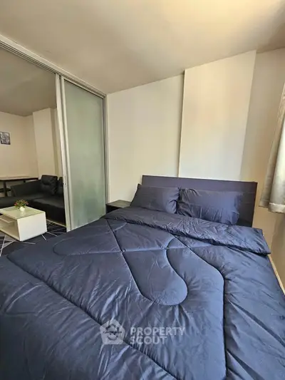 Modern bedroom with sleek design and cozy atmosphere, perfect for relaxation.