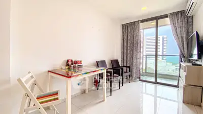 Bright living room with balcony and ocean view in modern apartment