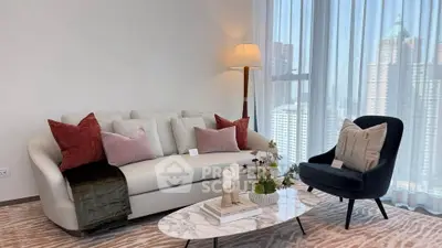 Stylish living room with modern furniture and city view, perfect for urban living.