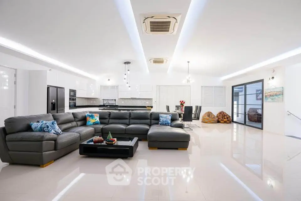 Spacious modern living room with sleek design and luxurious furniture