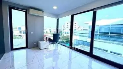 Modern corner unit with panoramic windows and stunning city view, perfect for urban living.