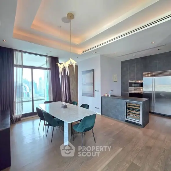 Luxurious dining area with modern kitchen and stunning city view
