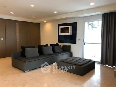 Spacious modern living room with sleek furniture and natural light