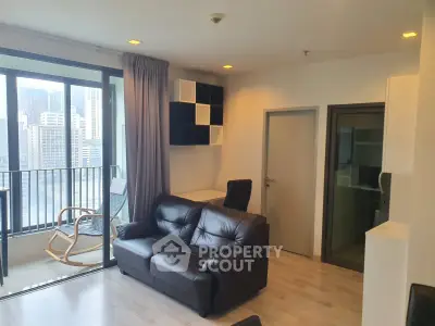 Modern living room with city view and stylish furniture in high-rise apartment