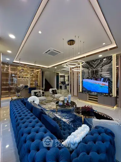 Luxurious living room with plush blue sofa and modern decor