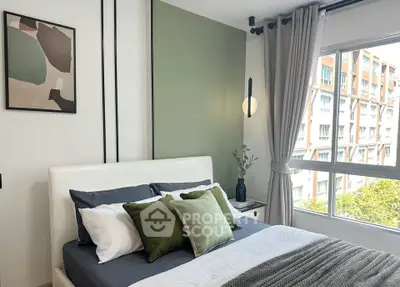 Modern bedroom with stylish decor and large window view