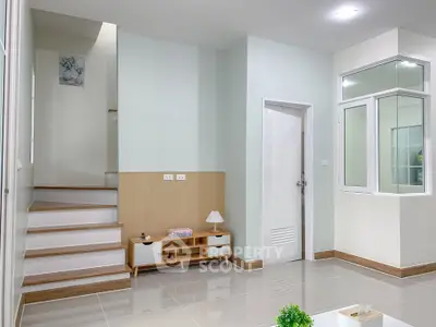 Modern minimalist living room with staircase and stylish decor