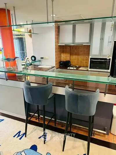 Modern kitchen with stylish bar seating and open layout
