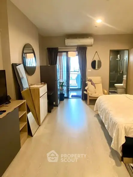 Modern studio apartment with balcony and stylish decor