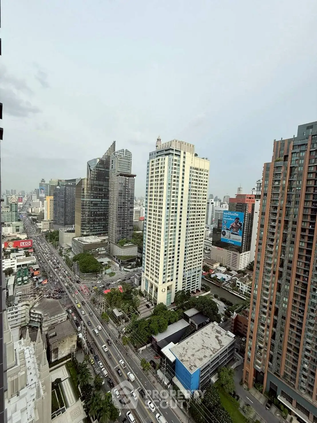 Stunning cityscape view showcasing modern high-rise buildings and bustling streets.