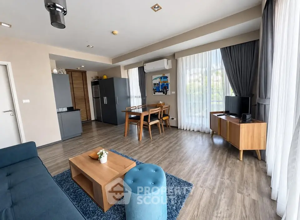 Spacious modern living room with open kitchen and stylish decor
