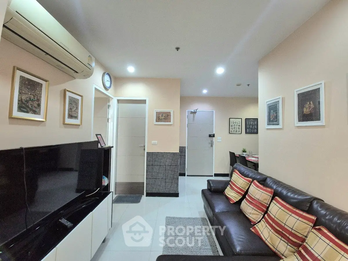 Modern living room with stylish decor and comfortable seating in a cozy apartment.