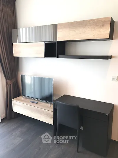 Modern living room with sleek TV unit and stylish desk setup
