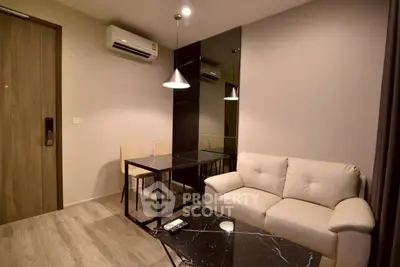 Modern living room with sleek furniture and air conditioning