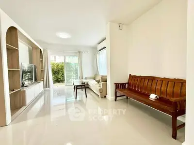 Spacious living room with modern furniture and natural light