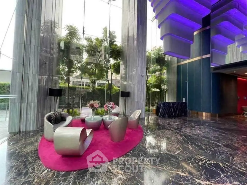 Luxurious modern lobby with sleek furniture and vibrant lighting