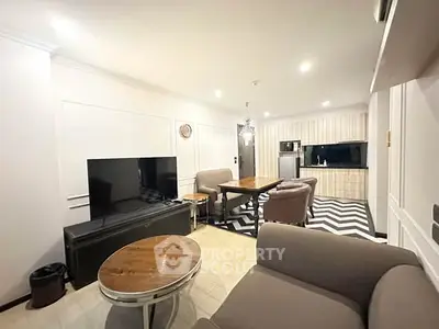 Spacious modern living room with open kitchen and stylish decor