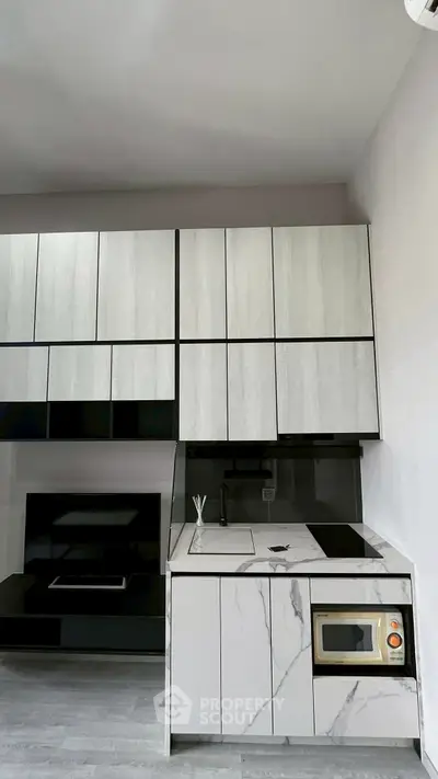 Modern kitchen with sleek cabinetry and built-in appliances