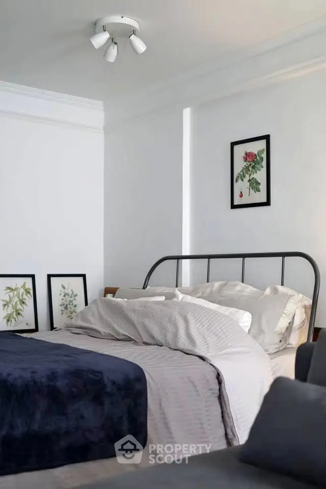 Cozy bedroom with stylish decor and comfortable bedding