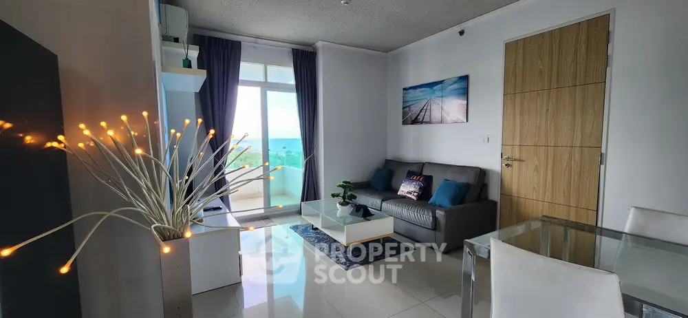 Modern living room with ocean view, stylish decor, and natural light