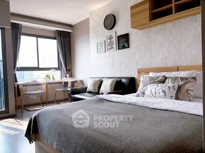 Modern bedroom with stylish decor and large window view