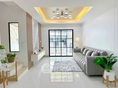 Spacious modern living room with elegant decor and large windows