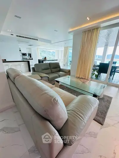 Luxurious open-plan living room with stunning views and modern furnishings