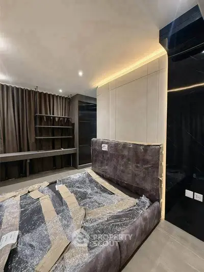 Modern bedroom with sleek design and ambient lighting