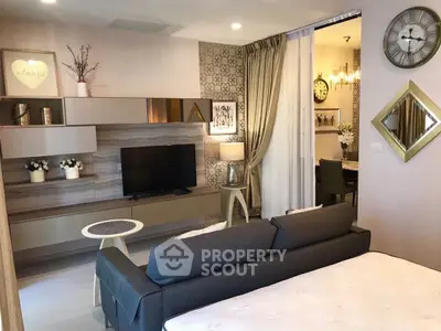 Modern living room with stylish decor and open layout to dining area