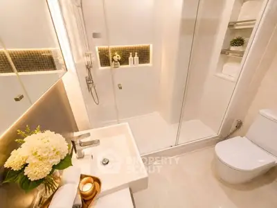 Luxurious modern bathroom with elegant lighting and sleek fixtures.
