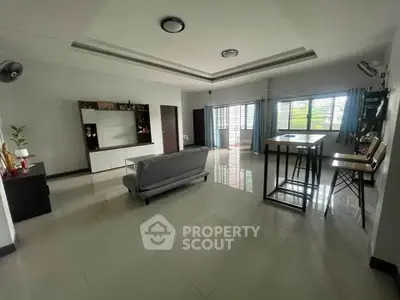 Spacious modern living room with sleek furniture and large windows