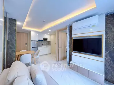 Modern living room with sleek design, open kitchen, and stylish decor in a contemporary apartment.