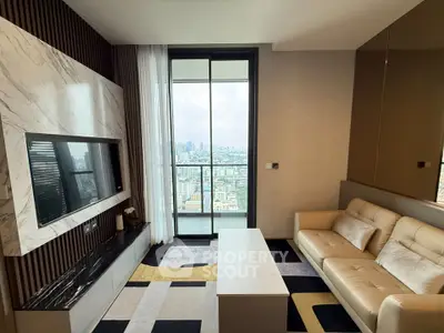 Luxurious living room with modern decor and stunning city view from balcony.
