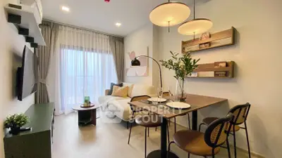 Modern living room with stylish decor and dining area, featuring large windows and contemporary lighting.