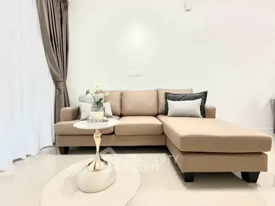 Elegant living room with modern beige sectional sofa and chic decor
