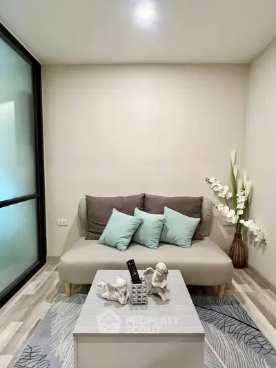 Cozy living room with modern decor and comfortable seating in a stylish apartment.