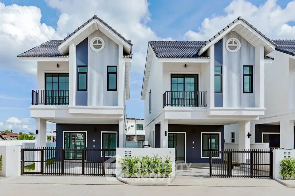 Modern twin houses with stylish design and spacious balconies in a serene neighborhood.