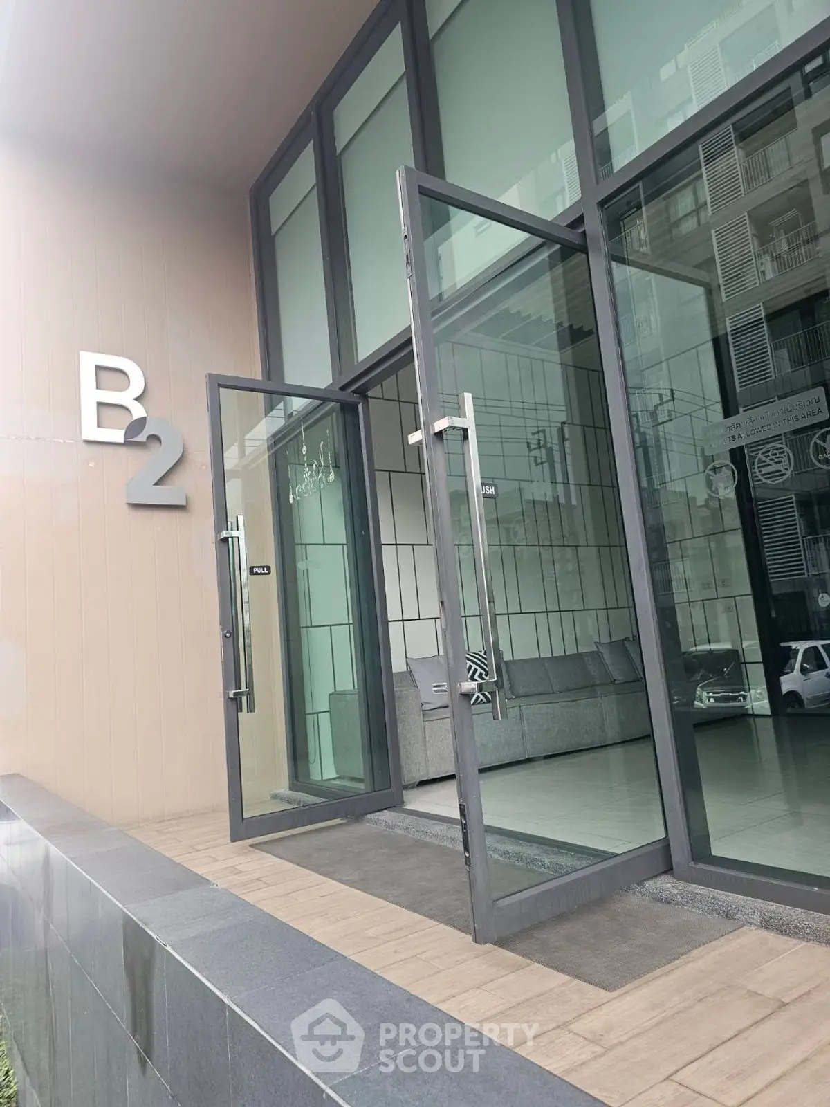 Modern building entrance with glass doors and sleek design