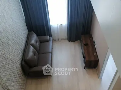 Modern living room with leather sofa and stylish wooden cabinet