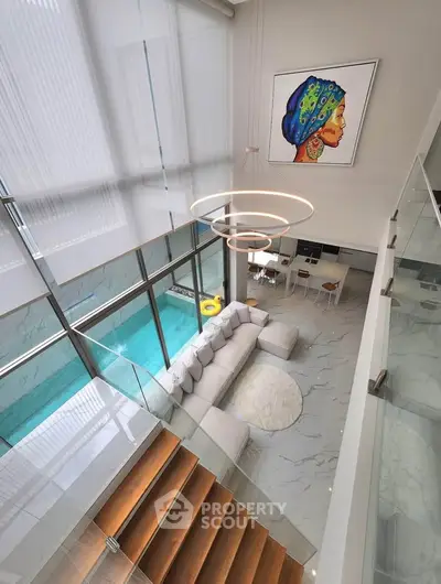 Luxurious modern living room with pool view and elegant decor