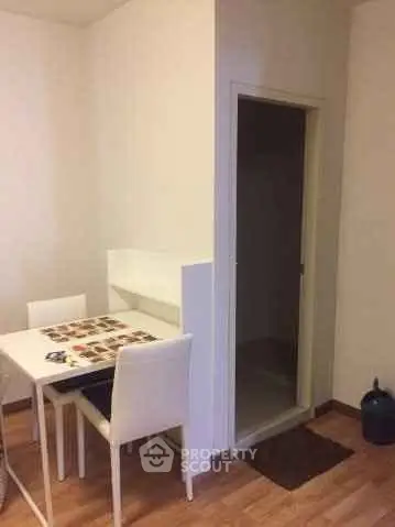 Cozy dining area with modern white table and chairs, perfect for intimate meals.