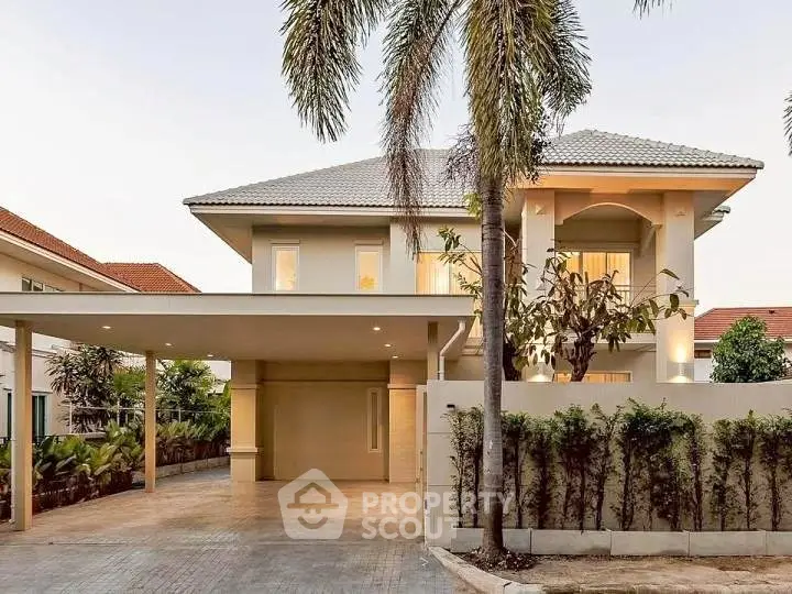 Stunning modern two-story house with spacious driveway and lush greenery, perfect for luxurious living.