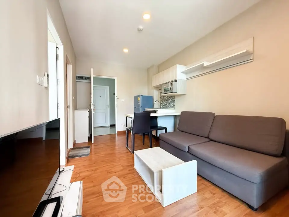 Modern living room with open kitchen and stylish furniture