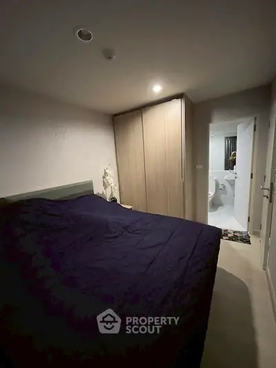 Cozy bedroom with modern wardrobe and ensuite bathroom